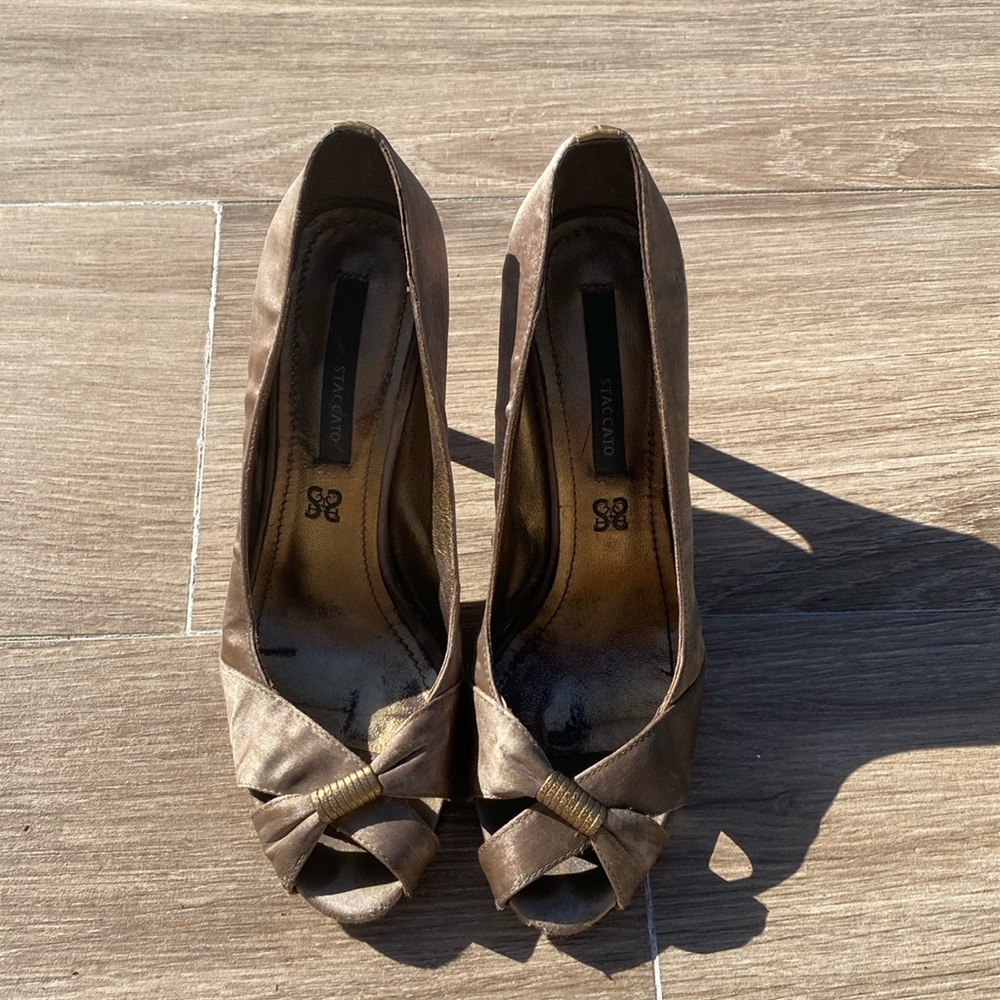 Staccato peep toe dressy sandal. 4 inch heel. Bronze satin